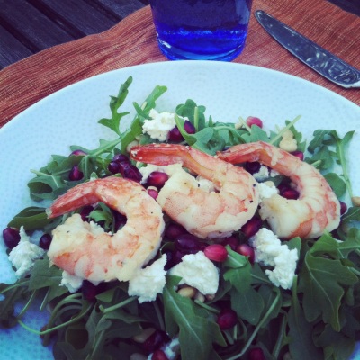 Arugula Salad topped with Grilled Shrimp, Pomegranate, Goat Cheese, and Pine Nuts 